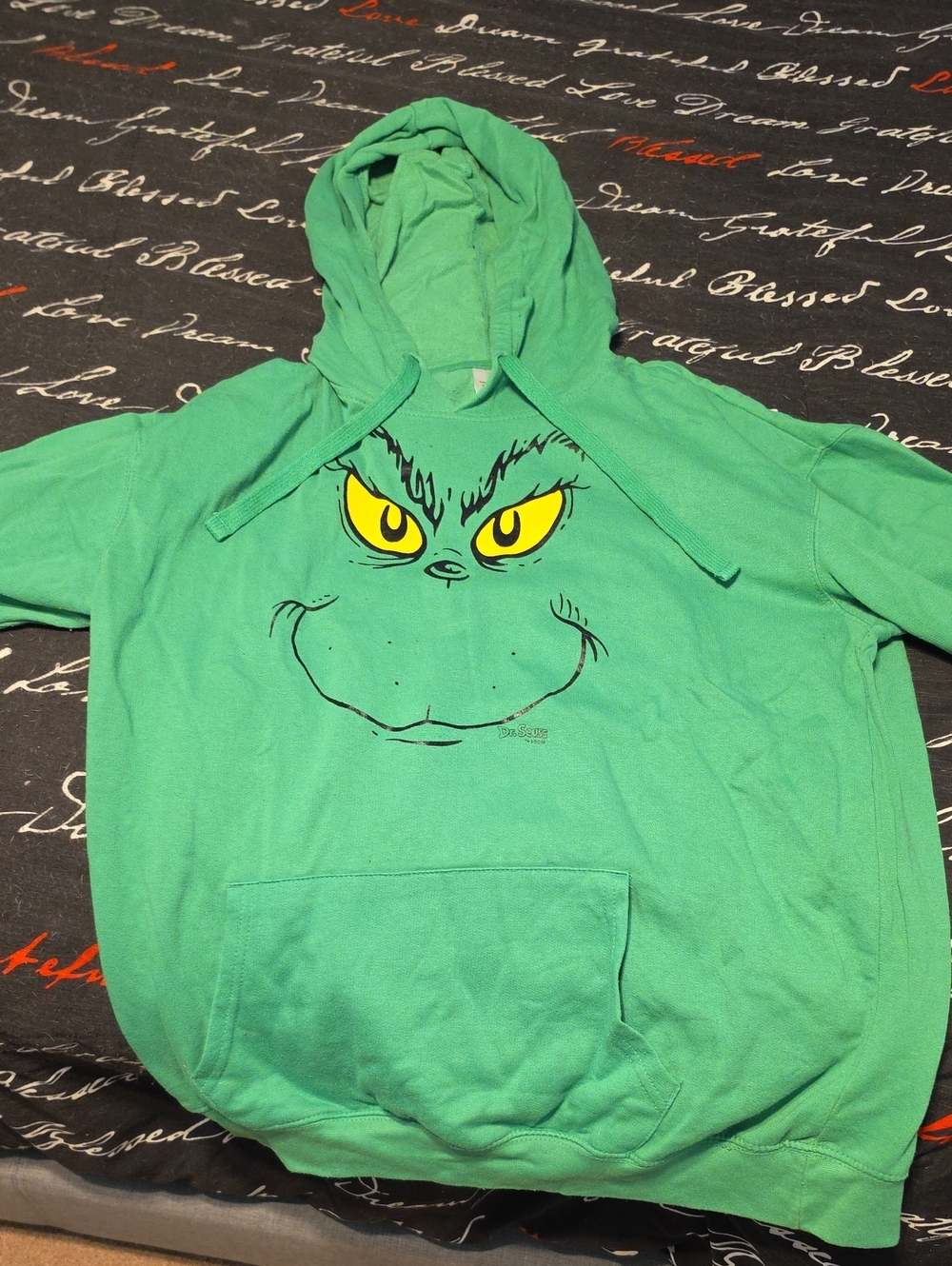 Green Grinch Hoodie with Yellow Eyes Graphic